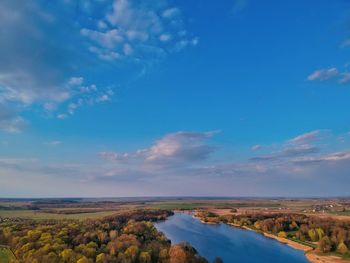 Scenic view of landscape against blue sky