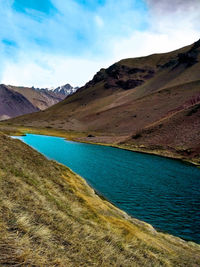 Scenic view of landscape and mountains against sky