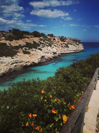 Scenic view of sea against cloudy sky