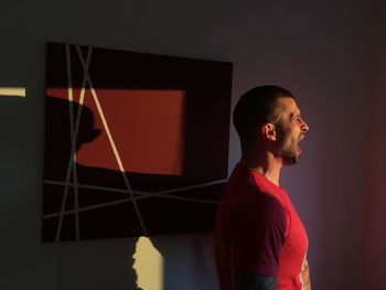 Side view of young man looking away