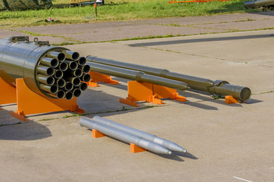 High angle view of metallic pipes on land