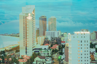 Buildings in city against sky