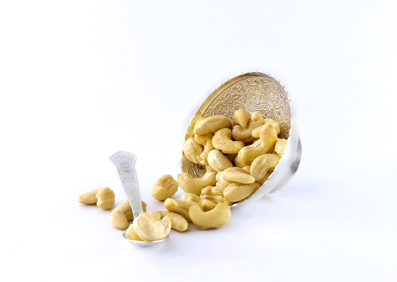 CLOSE-UP OF BREAD OVER WHITE BACKGROUND