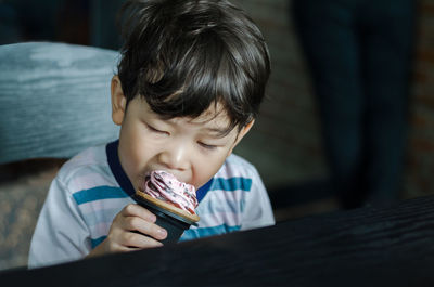 Portrait of boy eating food