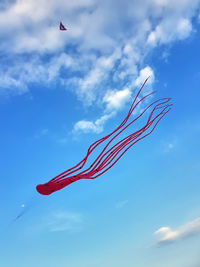 Low angle view of kite flying against sky