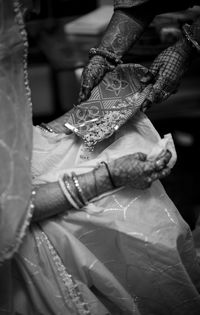 Low section of bride with henna tattoo