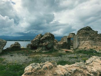 Panoramic view of buildings and rocks against sky