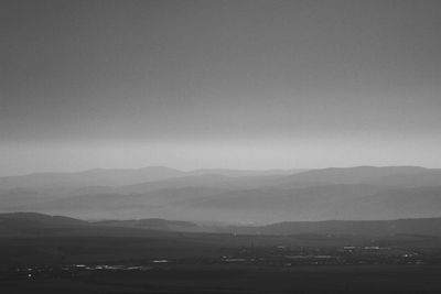 Scenic view of silhouette mountains against clear sky