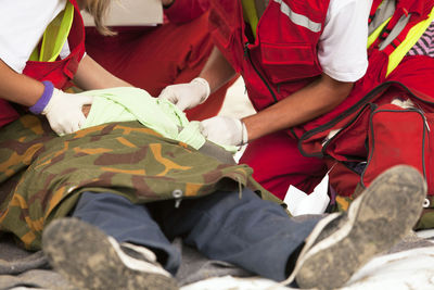 First aid training on man lying down