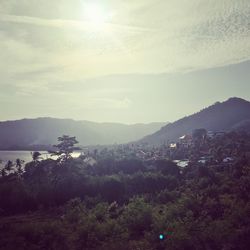 Scenic view of landscape against sky at sunset