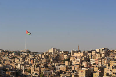 Low angle view of flag against clear sky