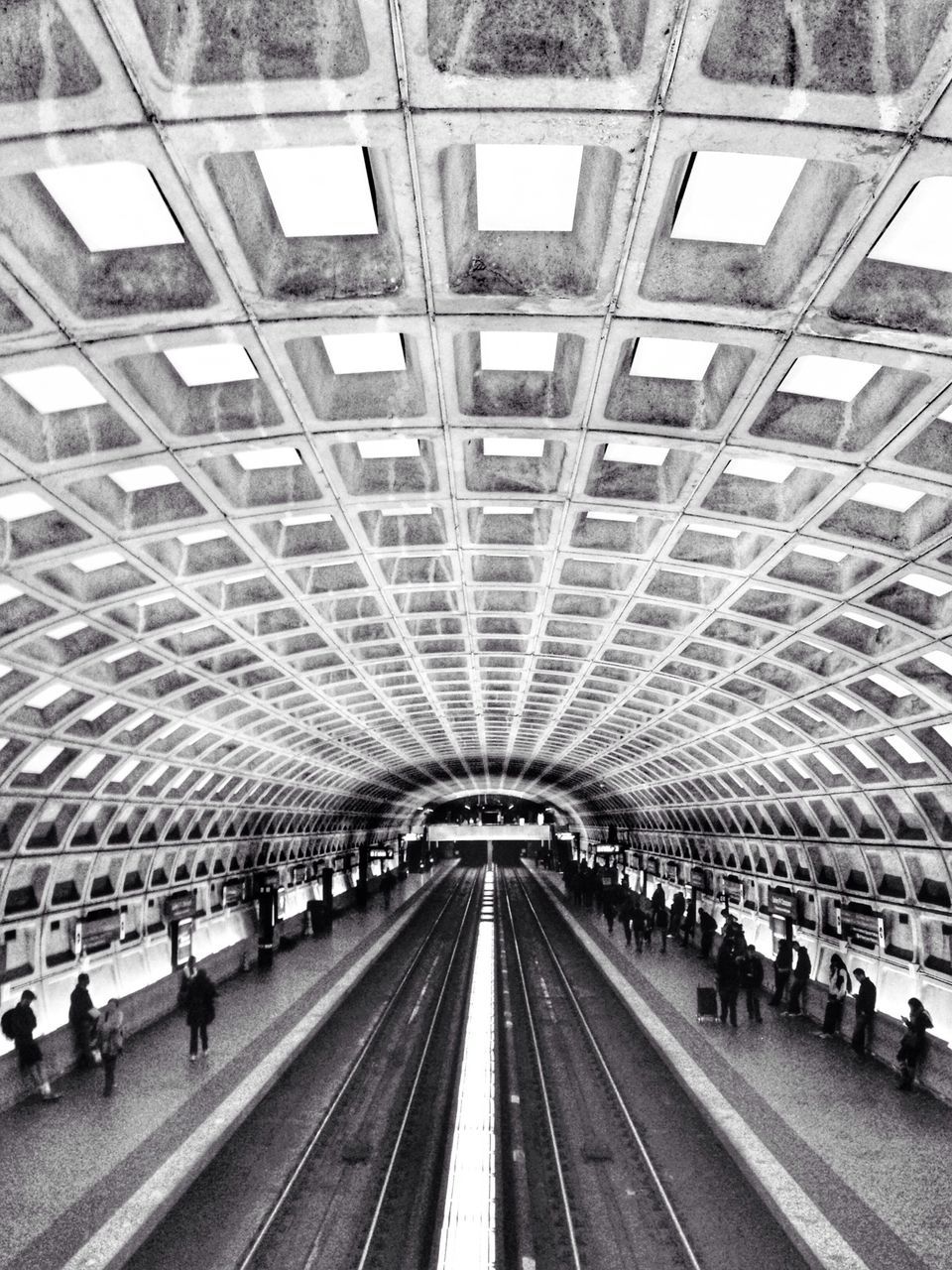 indoors, ceiling, large group of people, architecture, railroad station, built structure, transportation, public transportation, rail transportation, railroad station platform, railroad track, men, person, travel, lifestyles, transportation building - type of building, incidental people, city life, walking