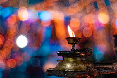 Close-up of illuminated lamp at night