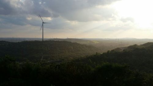 Scenic view of landscape against cloudy sky