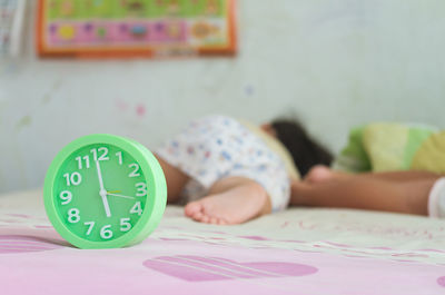 Close-up of a boy sleeping on bed at home