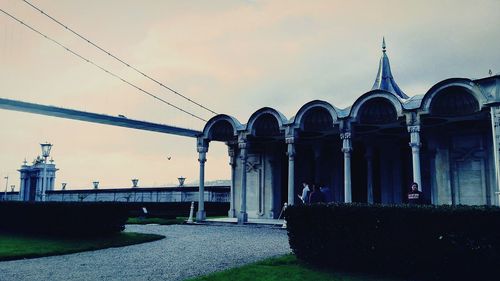 Panoramic shot of historic building against sky during sunset