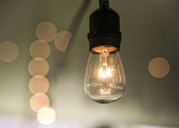 Close-up of illuminated light bulb