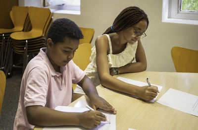 Side view of man working at office