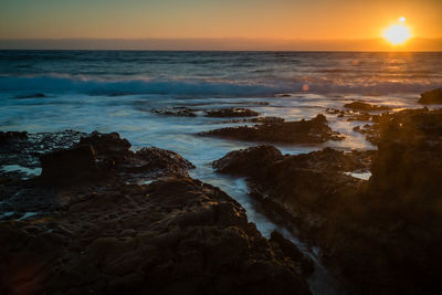 Scenic view of sea against sky during sunset