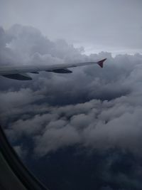 Low angle view of airplane flying in sky