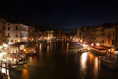 Illuminated buildings in city at night