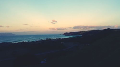 Scenic view of sea at sunset