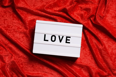 Love text on red fabric