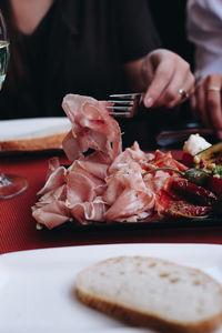 Close-up of person preparing food on table