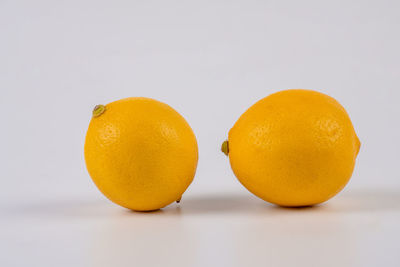 Close-up of lemon against white background