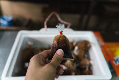 Close-up of hand holding food