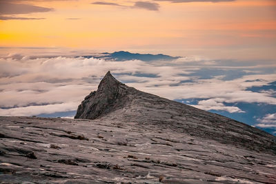 Scenic view of mountain against sky during sunset