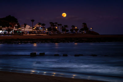 Scenic view of sea against sky at night