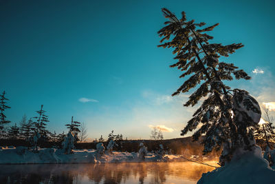 Scenic view of frozen lake against sky during winter