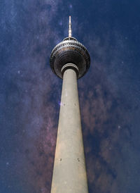 Low angle view of communications tower against sky