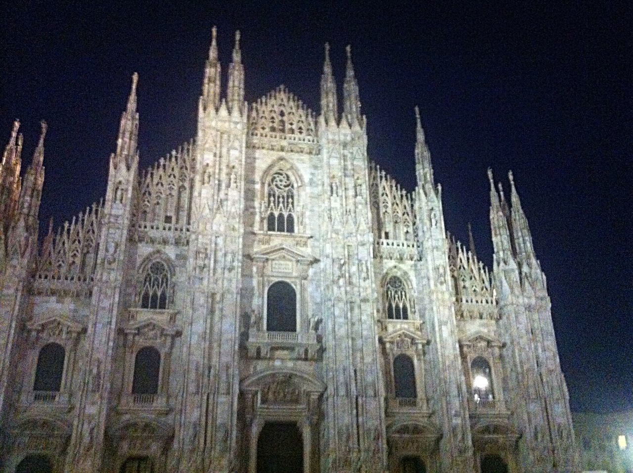 architecture, religion, built structure, place of worship, church, building exterior, spirituality, low angle view, cathedral, night, history, famous place, arch, travel destinations, sky, facade, illuminated, tourism