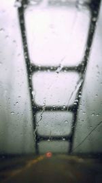 Close-up of rain drops on road