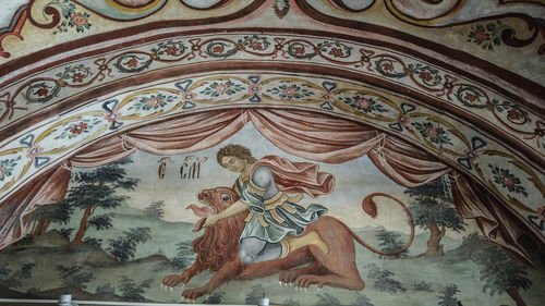 Low angle view of carving on wall
