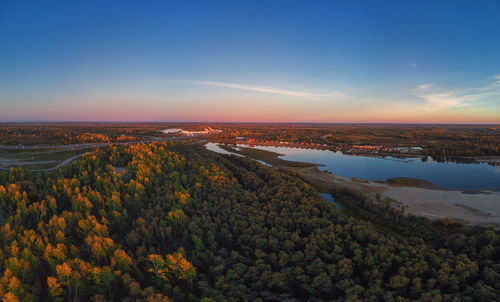 High angle view of land against sky during sunset