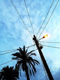 Low angle view of electricity pylon against sky