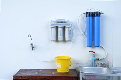 Close-up of water purifier on wall at home