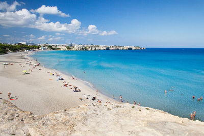 Scenic view of beach against blue sky