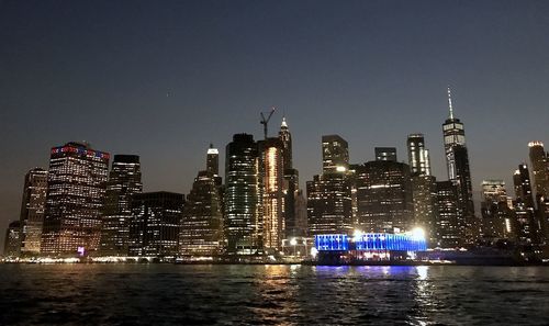 Illuminated buildings in city at night