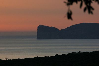 Scenic view of sea against romantic sky at sunset