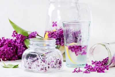 Close-up of flowers in jar on table