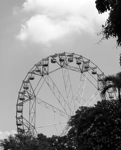 Low angle view of ferris wheel against sky