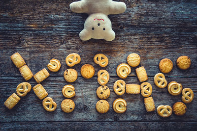 Xmas word made from gingerbread cookies on a wooden background. christmas background