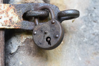 Close-up of padlock on metal door