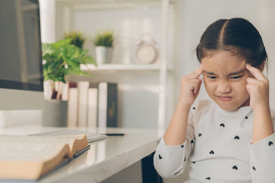 Portrait of a girl looking at home