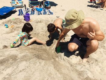 Boy sitting on beach