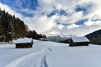 Scenic view of snow covered mountains against sky